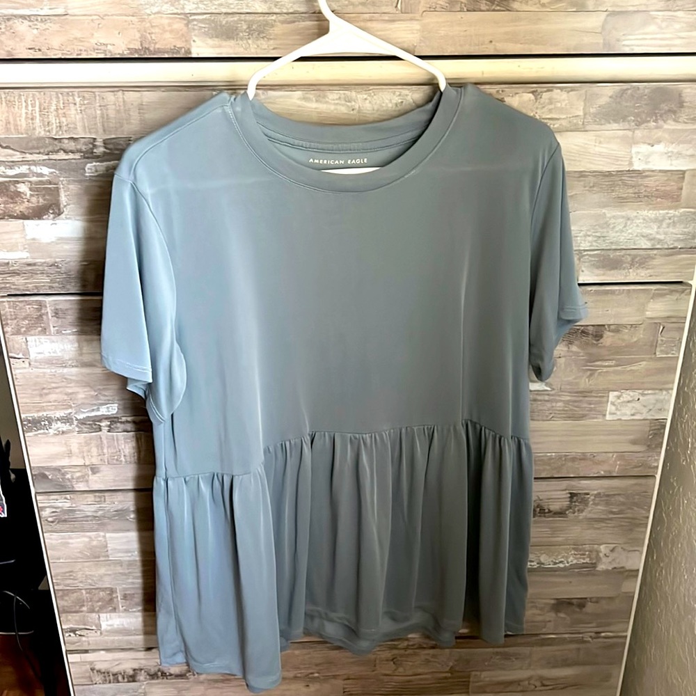 A light blue American Eagle shirt. Size medium